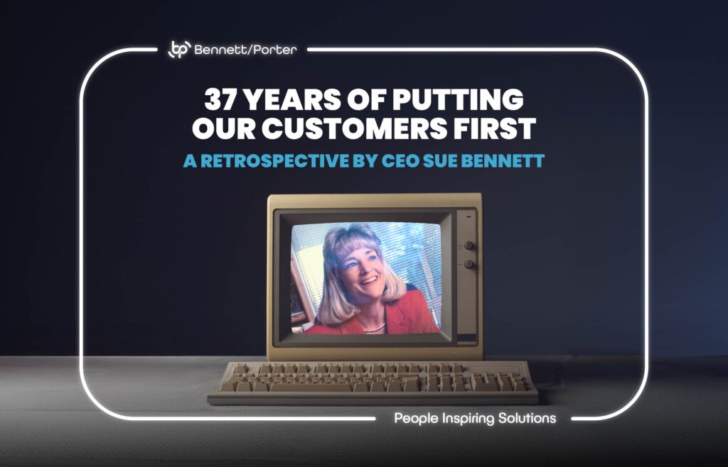 Retro computer monitor displaying CEO Sue Bennett smiling, with bold text reading “37 Years of Putting Our Customers First – A Retrospective by CEO Sue Bennett.” Featured image for a Bennett/Porter blog post celebrating nearly four decades of customer-focused business solutions and trusted ERP, HR, and IT services in the Pacific Northwest.